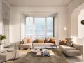 Un salon cocooning chaleureux avec un grand canapé d'angle, des coussins douillets et une vue imprenable sur un lac.