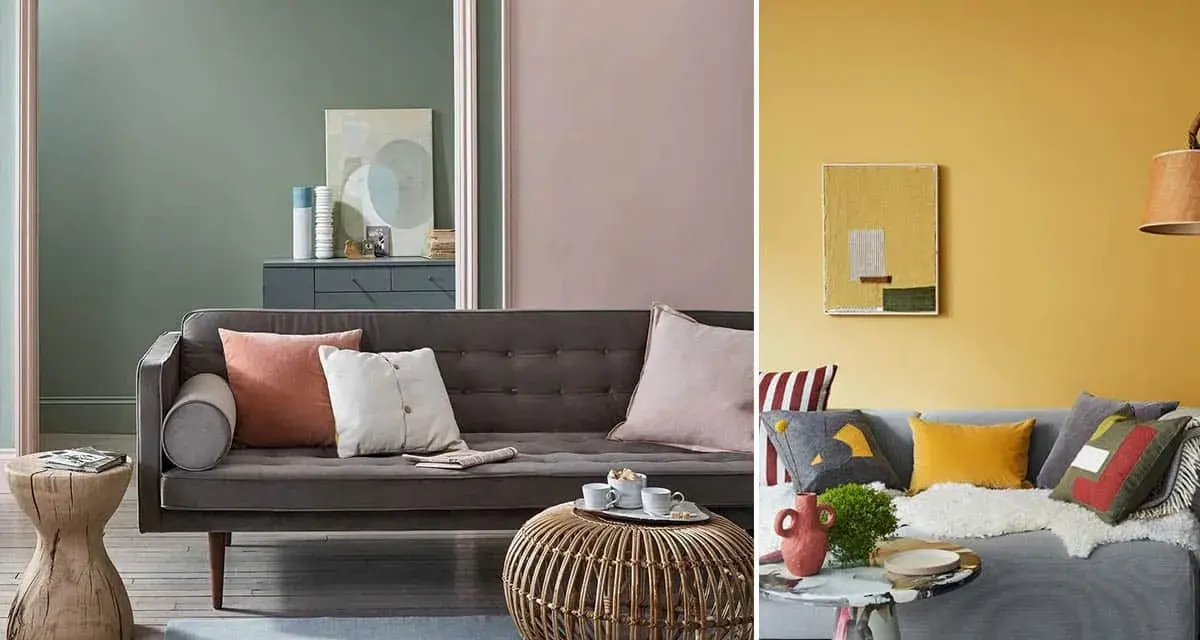 Canapé gris avec coussins aux couleurs variées, dont un coussin corail et un blanc cassé. Ambiance cosy et moderne.