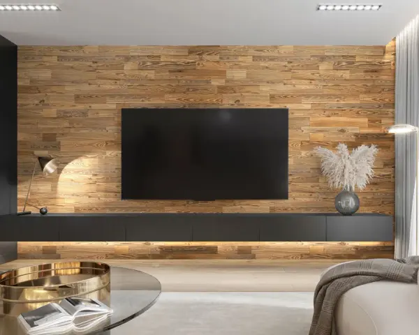 Un salon moderne avec un mur en bois chaleureux servant de **déco derrière télé**. Un meuble bas suspendu et une lampe design complètent l'ensemble.