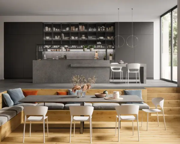 Aménagement moderne d'un salon salle à manger 12m2 avec banquette, table et cuisine ouverte.