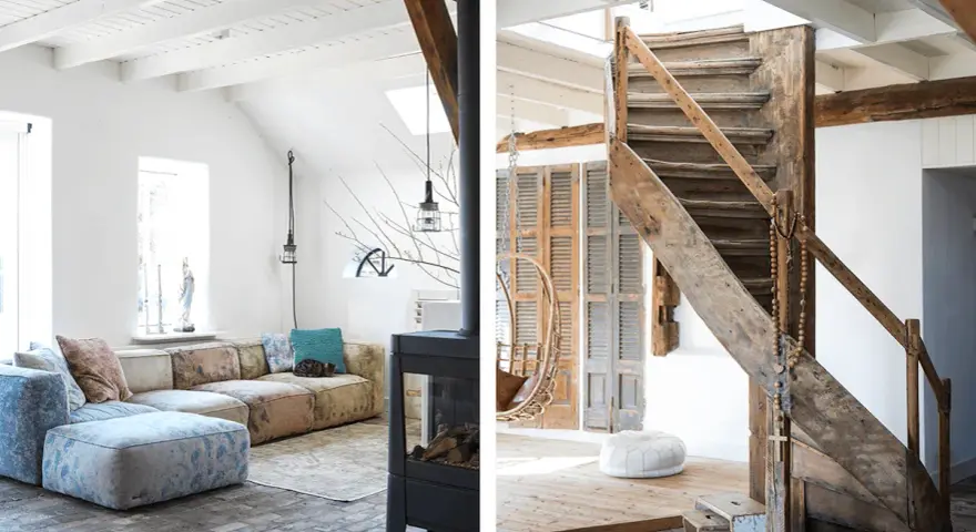 Ambiance chaleureuse dans cet **intérieur ferme rénovée moderne**. Canapé modulable, poêle design et escalier rustique en bois.