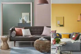 Canapé gris avec coussins aux couleurs variées, dont un coussin corail et un blanc cassé. Ambiance cosy et moderne.