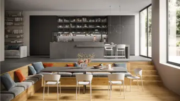 Aménagement moderne d'un salon salle à manger 12m2 avec banquette, table et cuisine ouverte.